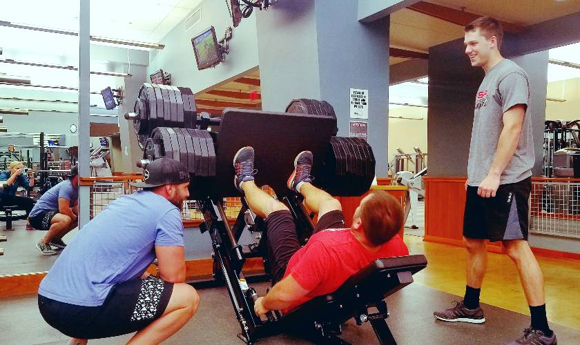 students doing leg press